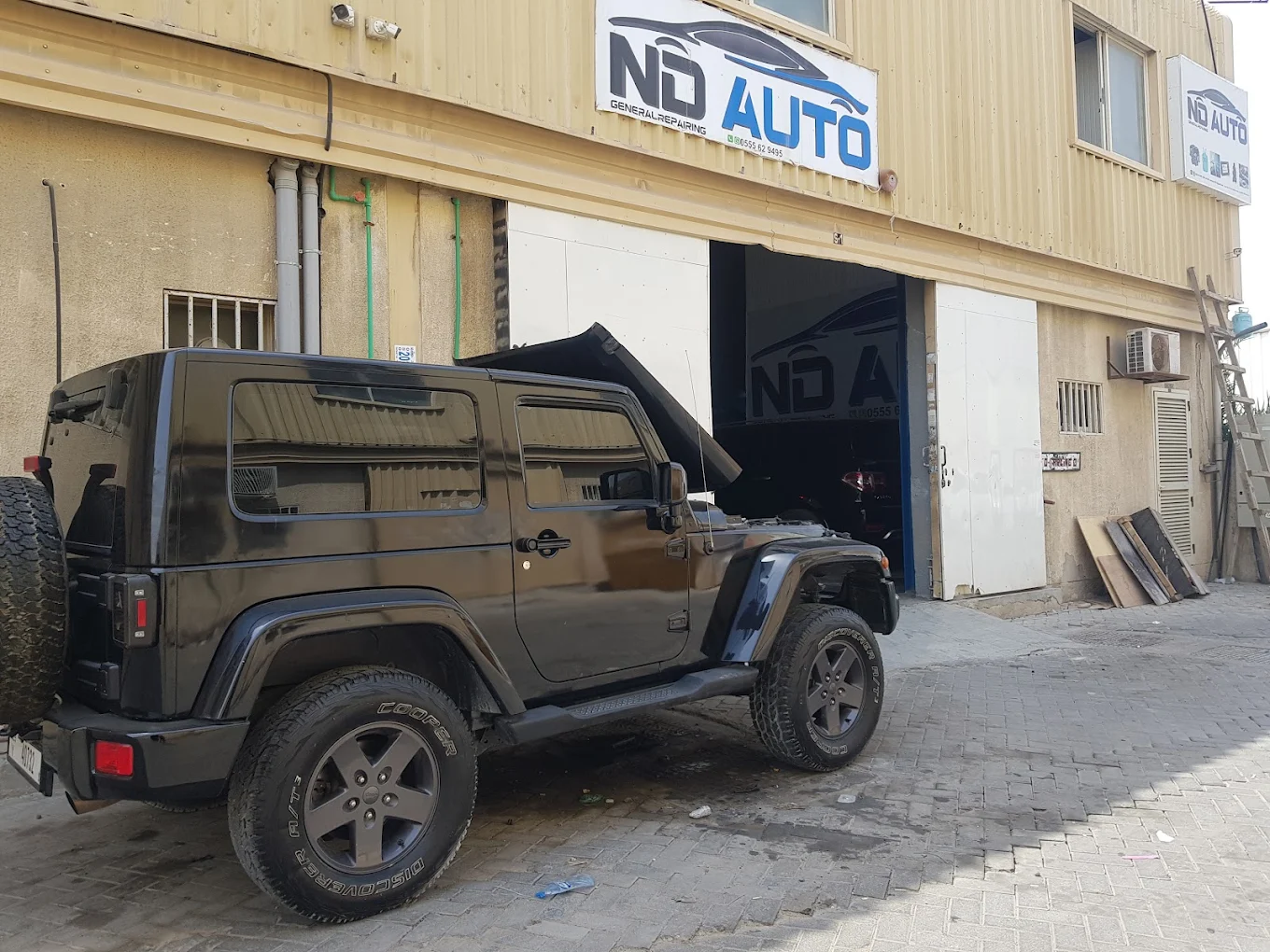Jeep Wrangler outside ND Auto General Repair garage